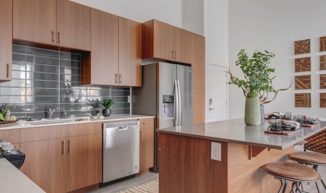 a kitchen with wooden cabinets
